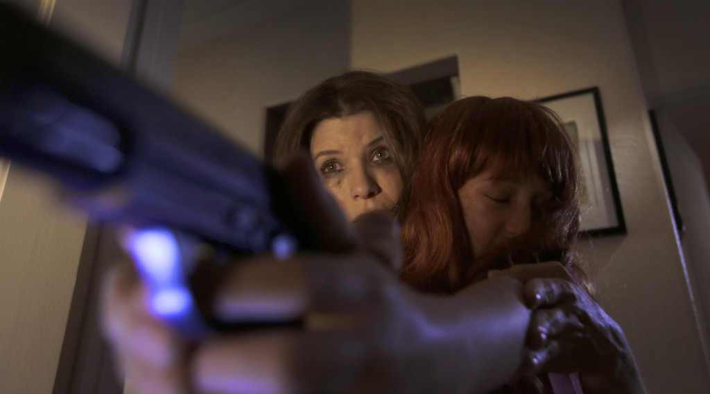Louise Sutton (Tammy Klein) forced to violence in "Rage of Innocence"