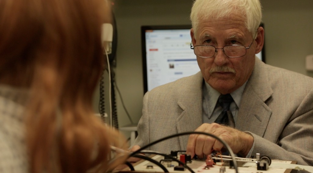 Ken Briant looking pretty darn official as the polygraph technician