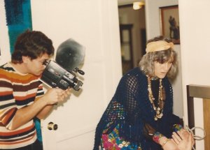 Pirromount filmmaker Mark Pirro holding a Chinon Super 8 camera, filming actress Sharon Alsina as Madame Muddyooch