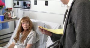 Raven (Stef Dawson), in a hospital bed, is questioned by attorney Chet Neimano (Doug MacPherson).
