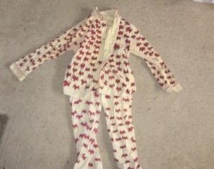 Bat pajamas, beige with red bats painted on.
