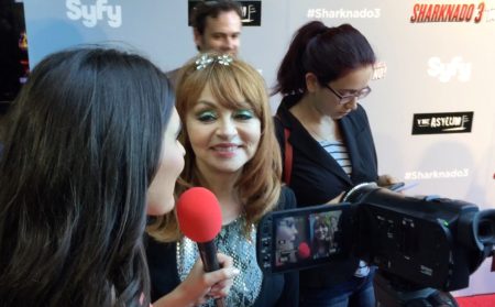 Interviewer filming comedian Judy Tenuta at Sharknado red carpet